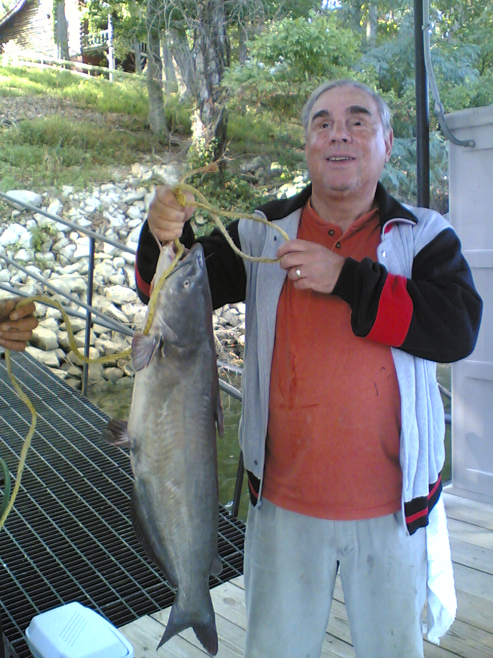 Picture of Author Dr. Ron Milliman holding the large 13 pound blue Cat Fish.